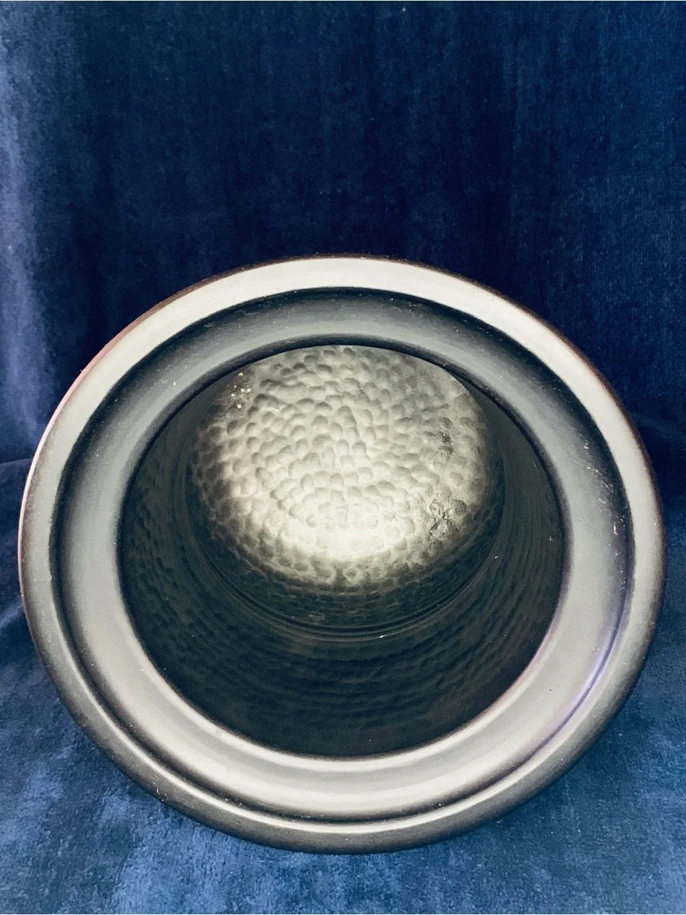 Decorative Urn Vase With a hammered interior design.